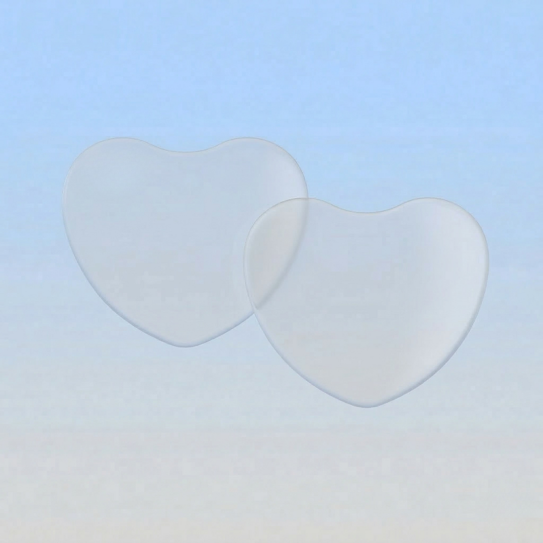 Two heart-shaped lenses on a gradient blue to beige background