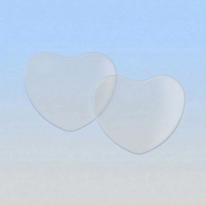 Two heart-shaped lenses on a gradient blue to beige background