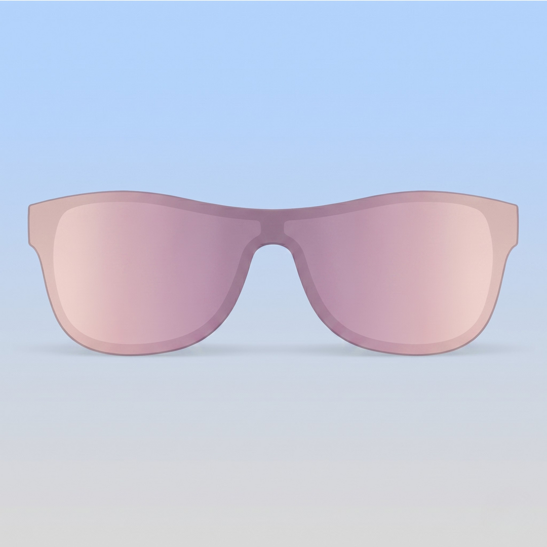 Pink sunglasses lens on  a blue background